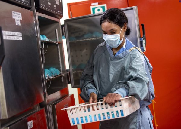 Hospital Corpsman 3rd Class Sudan Roache, from Severn, Md., stores N95 masks in casualty receiving aboard the hospital ship USNS Mercy (U.S. Navy photo by Mass Communication Specialist 2nd Class Ryan M. Breeden)