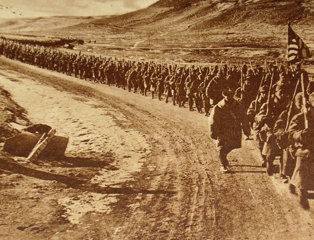 American troops walking along a road during World War I. (Wikimedia)