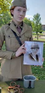 Governors Island Sept 16, 2018: Reenactor Lillian Fehler holding a picture of the historical person she portrays: Dr. Anna Tjomsland. (Camilla Hsiung)