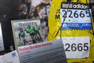 A runner’s bib, a Sports Illustrated magazine cover and other artifacts associated with the Boston Marathon bombing of April 15, 2013, are on display at the National Museum of Crime & Punishment in Washington DC, as part of a permanent exhibit on domestic terrorism and hate crimes. (Larry Luxner)