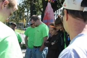 Pausing for prayer with a group of volunteers.