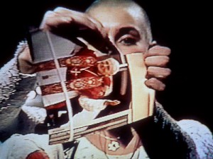 Sinead O'Connor rips up a photo of Pope John Paul II on live TV, shocking audiences and producers alike